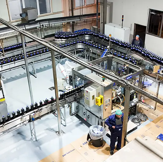 Automated bottling machines running beverage lines